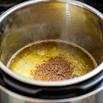 cumin seeds popping in cooker