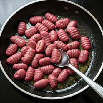 cooked gnocchi to the skillet