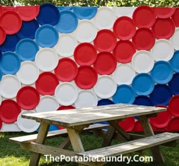 13. Paper Plate Wall Backdrop Behind the Table