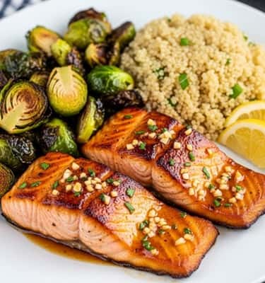 14. Honey Garlic Glazed Salmon with Roasted Brussels & Quinoa