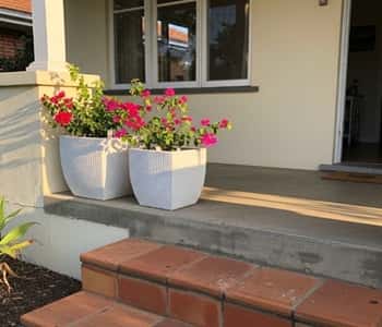 2. White Rattan-Look Planters for Front Porch