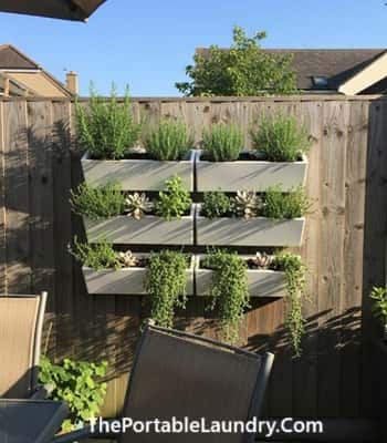 5. White Tiered Wall-Mounted Planters for Vertical Gardens