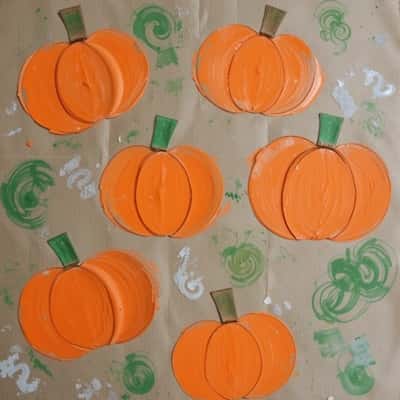 8. Pumpkin Stamping with Toilet Paper Rolls