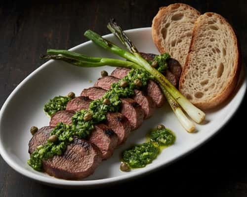 12. Grilled Tongue with Salsa Verde and Charred Scallions