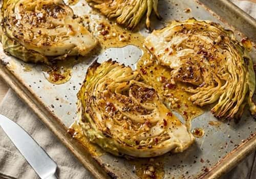 1. Slow-Roasted Cabbage Steaks with Honey Chili Butter
