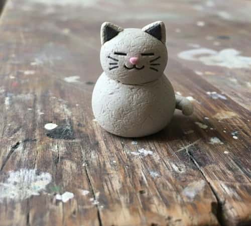 12. Clay Cat with Curled Tail