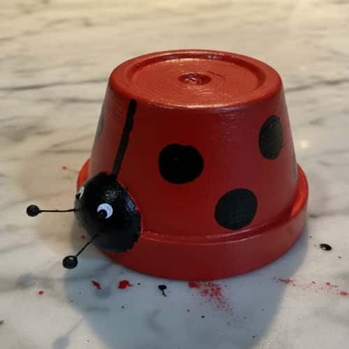 4. Upside-Down Clay Pot Ladybug Decor (Instant Smile Maker)