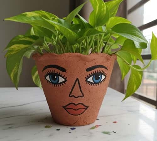 11. Face Planter Clay Pot Painting