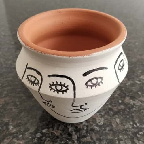 8. Minimal Line Art Face Clay Pots