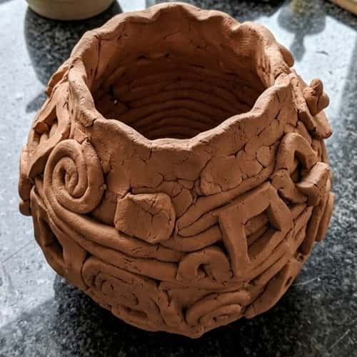 12. Sculpted Abstract Clay Vase