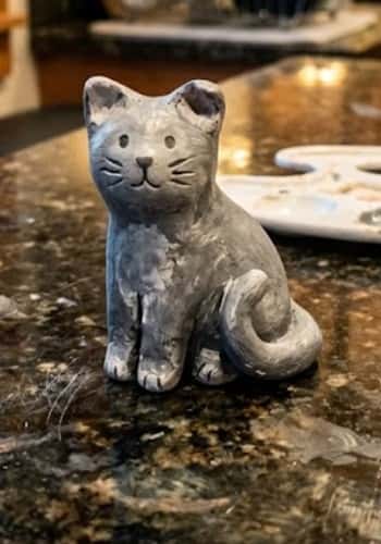 4. Sleepy Barn Cat with Curled Tail