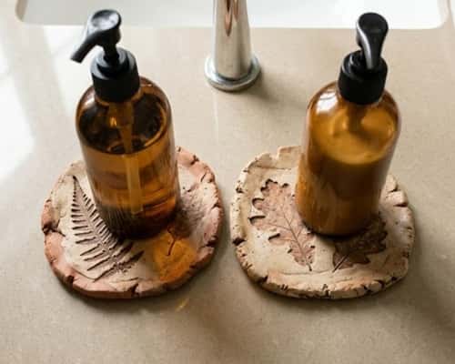 5. Leaf-Imprint Clay Coasters for Bathroom Corners