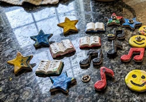 9. Clay Badge Pins for After School Club Fun