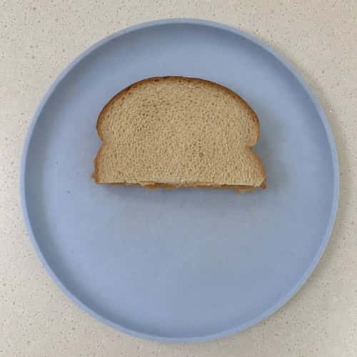 6. Plain Peanut Butter on White Bread (Halved, No Jam)