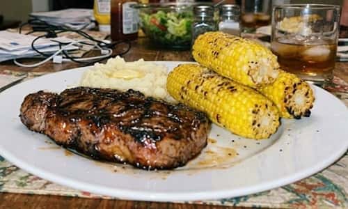 2. Bourbon Glazed New York Strip with Grilled Corn
