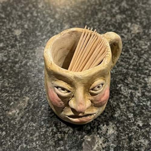 2. Tiny Face Mug That Holds Toothpicks