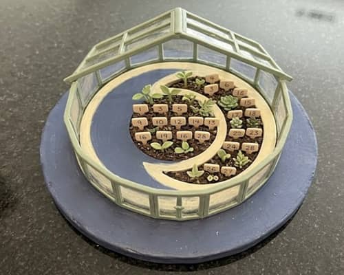 2. Tiny Greenhouse Calendar With Plant Markers