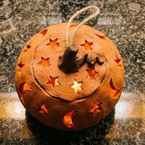 4. Pumpkin Lantern With Star Cutouts