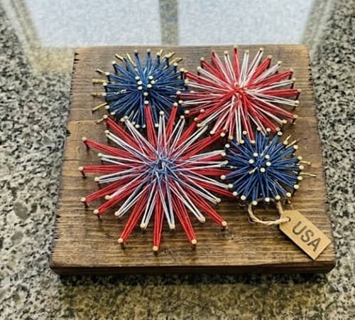 7. Framed Fireworks String Art Panel