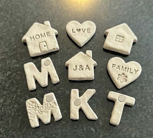 7. Personalized Clay Fridge Magnets with Family Themes