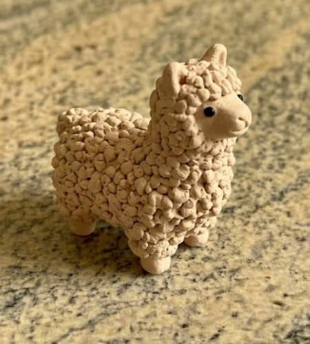 9. Pocket-Sized Fluffy Alpaca