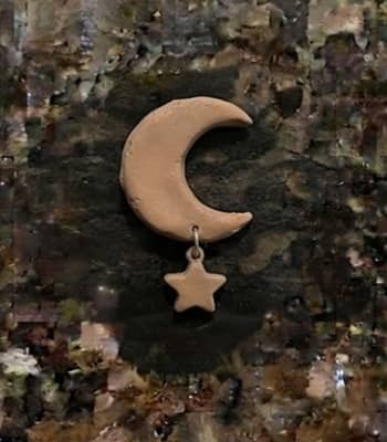 11. Tiny Sleeping Moon With Dangling Star