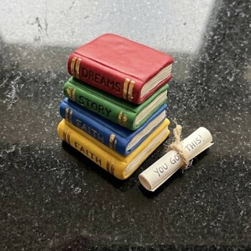 2. Tiny Book Stack Desk Buddy with Hidden Encouragement Note