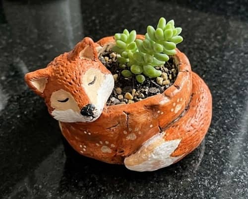 4. Whimsical Sleeping Fox Planter