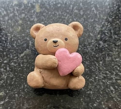 6. Cozy Teddy Hugging a Heart