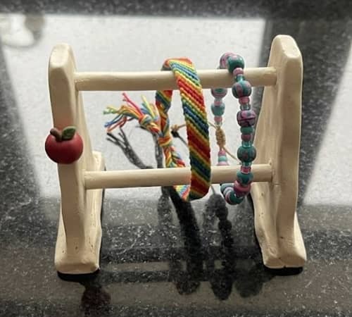 7. Mini Friendship Bracelet Holder with Clay Apple Accent