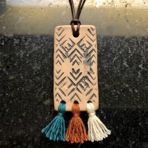 7. Textured Stamp and Tassel Statement Piece