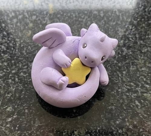 7. Tiny Lavender Dragon Curled Around a Star