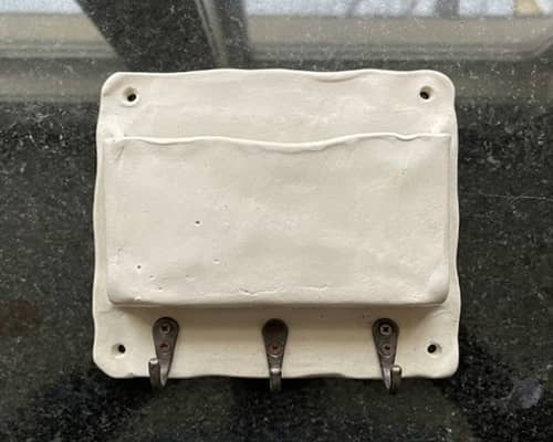 7. Wall-Mounted Mail Pocket With Key Hooks