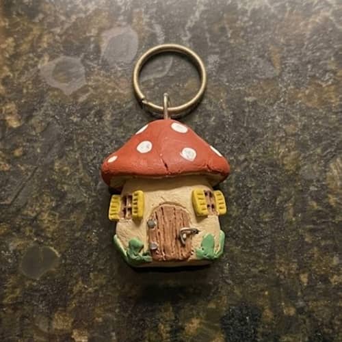 8. Cozy Mushroom Cottage Keychain