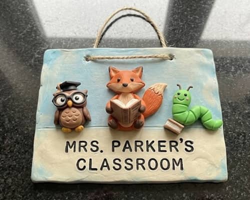 8. Storybook Door Hanger with Tiny Reading Friends