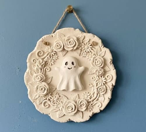 9. DIY Ghost Floral Wreath Plaque