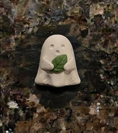 9. Tiny Raindrop Ghost Holding a Leaf
