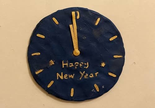 1. Midnight Clock Clay Wall Plaque