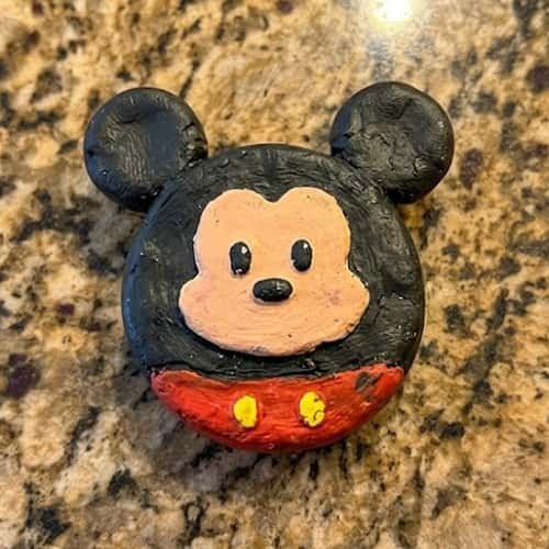 10. The Mini Mickey Clay Face Badge