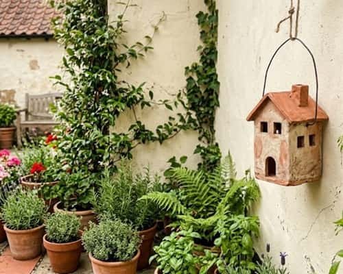 10. Tiny Clay House Lantern