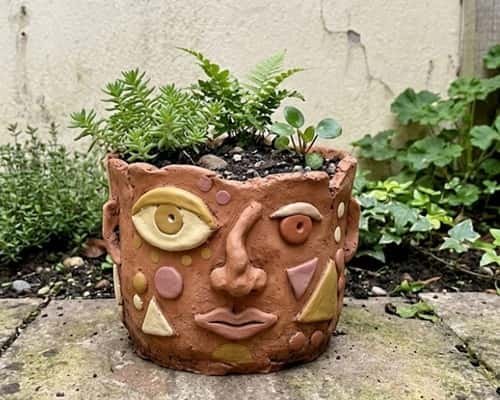 12. Abstract Clay Face Planter