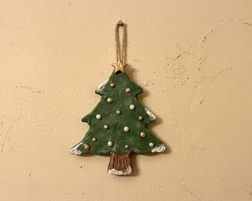 2. Rustic Clay Christmas Tree Wall Hanging