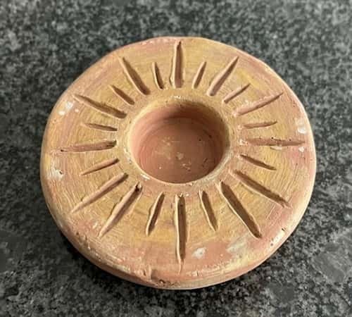 2. Sunburst Disc Candle Holder