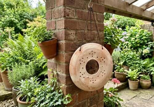 4. Hanging Clay Disc Lantern