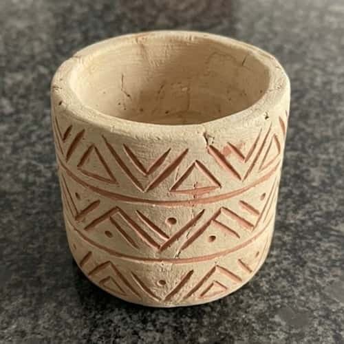 5. Textured Tribal-Inspired Clay Cup
