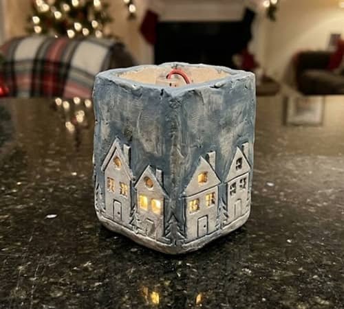 7. Christmas Village Clay Lantern