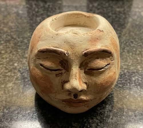 9. Abstract Face Clay Candle Holder