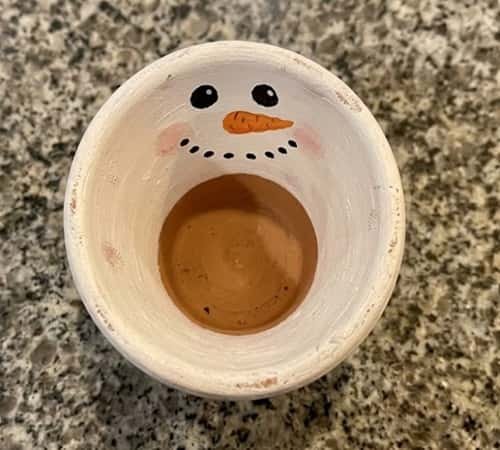 9. Snowman Face Clay Pot