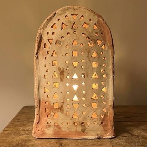 1. Arched Cutout Boho Clay Table Lamp