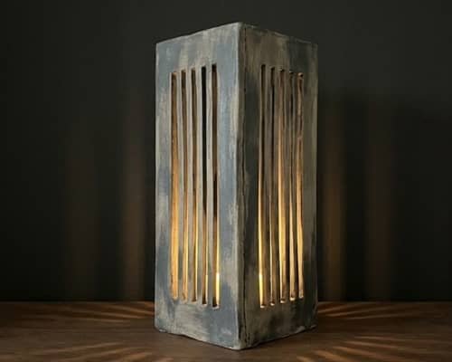 4. Skinny Vertical Lantern With Slit Windows